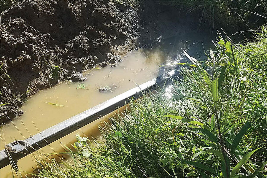 Cleaning a clogged culvert with the Culvert Cleaner