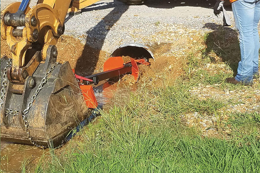 Cleaning a clogged culvert with the Culvert Cleaner