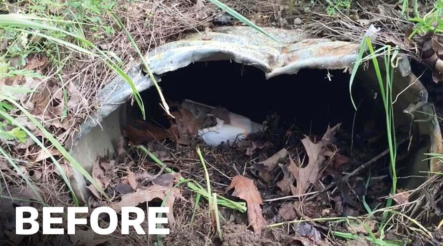 Bent and clogged culvert before Culvert Cleaner is used