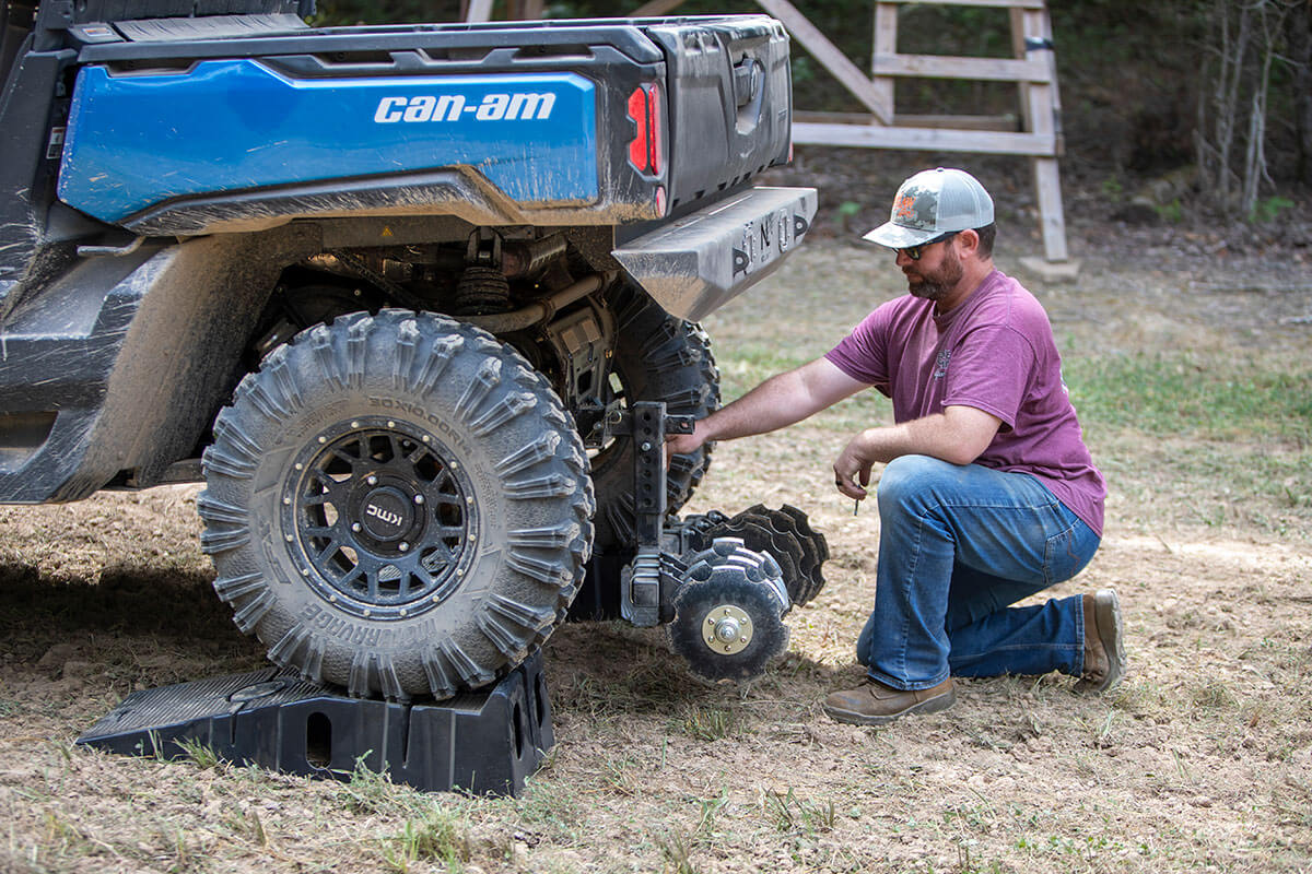 Lowering the Big Buck Food Plot Plow on an UTV after initial groundbreaking