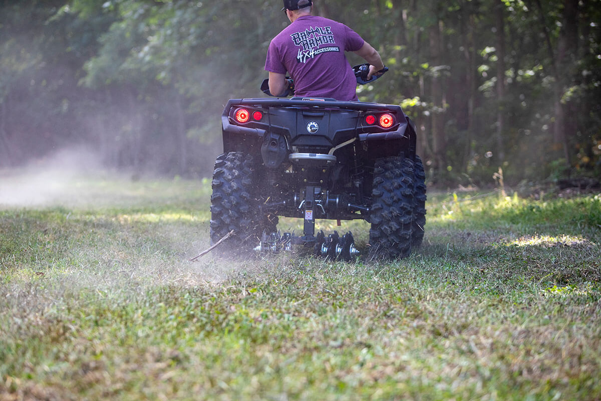 Making an initial groundbreaking with the Big Buck Food Plot Plow on an ATV